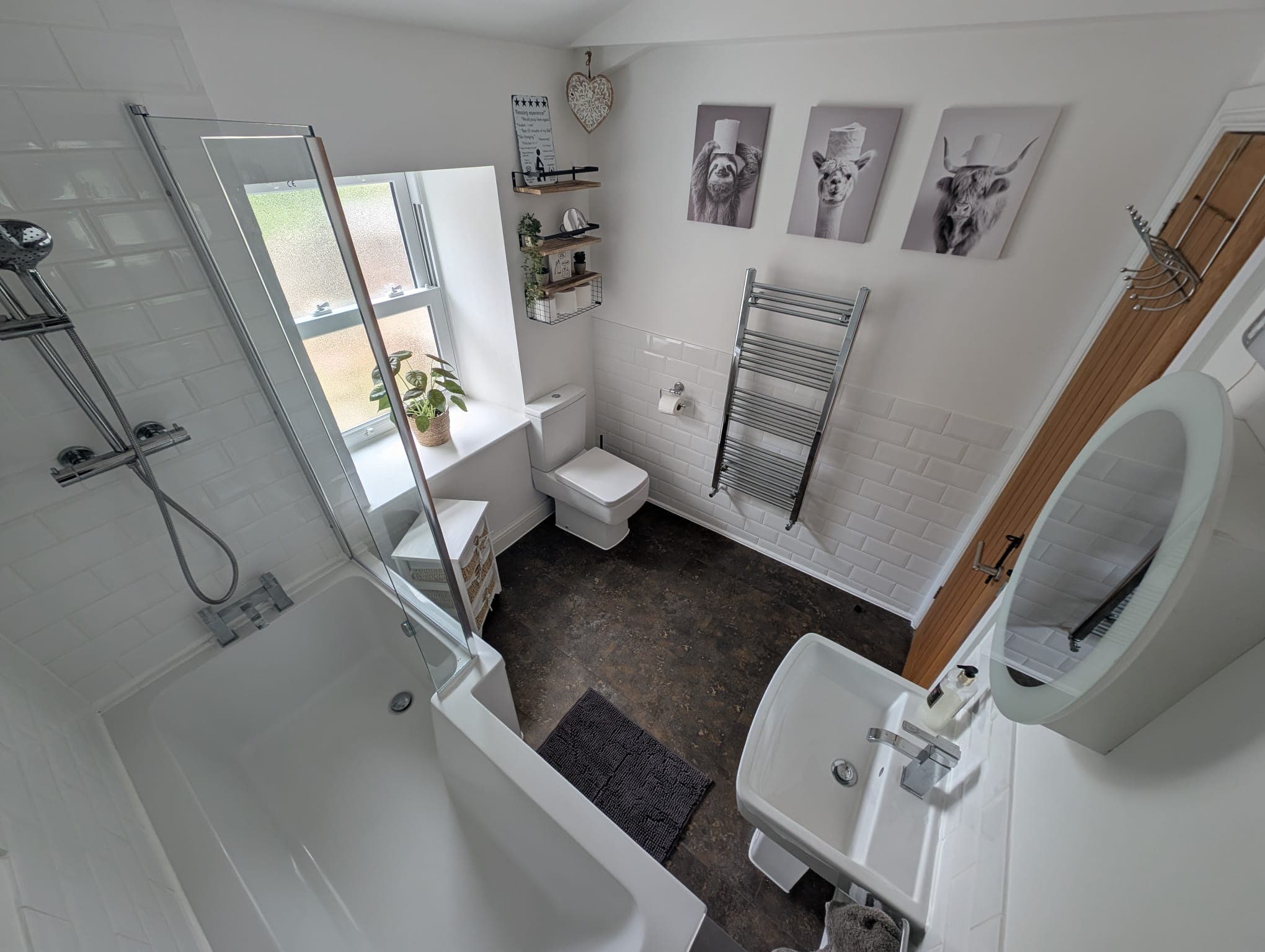 Family bathroom with shower over bath and heated rail